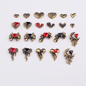 Vintage gold alloy nail charms set with heart, bow, and moon shapes featuring red gems