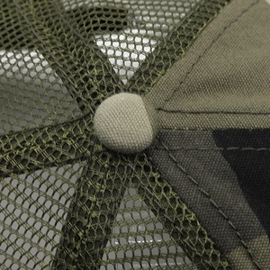 Detailed close-up of camouflage mesh panel and button on the breathable baseball cap