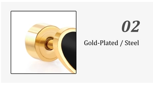 Macro detail of gold-plated steel heart stud earring showing the back and black enamel