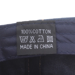 Detailed view of the 100% cotton wash label on a vintage washed cotton baseball cap