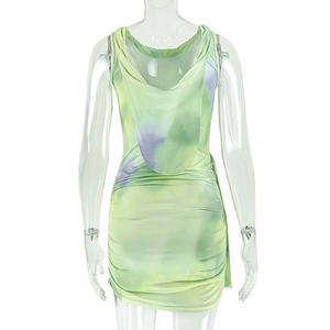 Detail of ruched sides and cowl back on a green tie-dye sleeveless mini dress