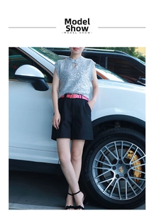 Fashionable sequin top and black shorts set styled with a pink gold-buckle leather belt