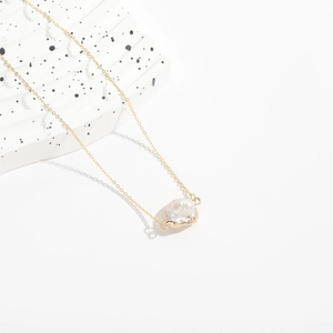 Gold plated copper chain necklace featuring a baroque freshwater pearl pendant