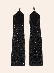 Detail of black long fingerless gloves featuring ruching and silver rhinestones