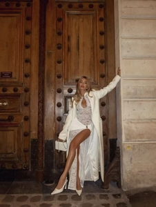 Elegant French style white lace dress paired with a matching long coat on a model
