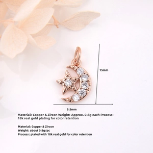 Detailed macro view of 18k gold plated copper crescent star pendant with cubic zirconia