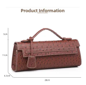 Detail showing deep brown ostrich texture leather bag with dimensions 28x11x6.5cm