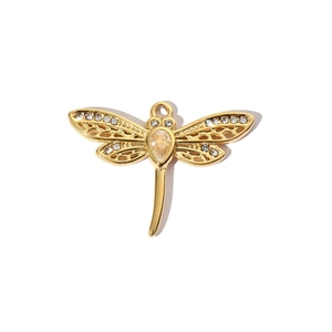 Detailed view of a gold dragonfly pendant featuring yellow gemstones and white zircons