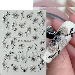 Detail of 5D embossed nail stickers featuring silver glitter black flowers and leaves