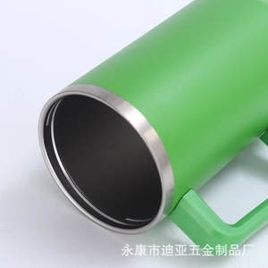 Close-up of a 40oz green insulated tumbler featuring a sturdy handle and stainless steel rim