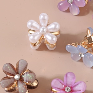Elegant floral resin hair claw clips with pearls and gold metal base in multiple colors