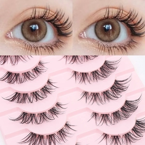 Natural wispy fake eyelashes with thin fish line band on a pink base