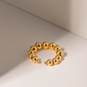 Detailed close-up of 18k gold plated stainless steel ear cuff with graduated beads design