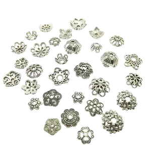 Various styles of silver-tone floral bead caps and spacers for DIY bracelet making