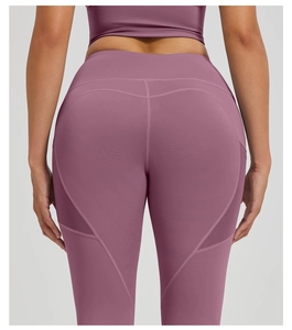 Detail view of high waist yoga leggings with breathable mesh panels and V-shaped seam
