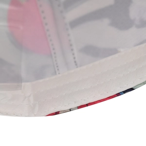 Detail view of cotton baseball cap stitching with colorful abstract print and white lining