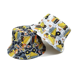 Kids reversible bucket hats with colorful construction truck prints in black and white