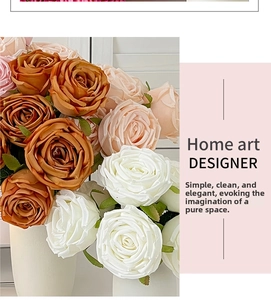 Detailed close-up of multi-color artificial rose bouquet in two white minimalist vases