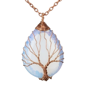 Detail of tree of life wire-wrapped opal pendant with copper wire and teardrop stone