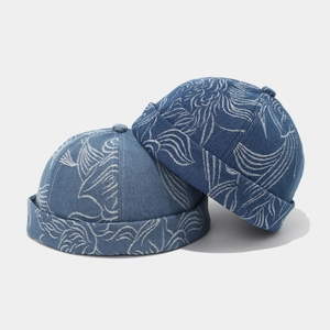 Detailed texture of denim docker hats with white wavy patterns in light and dark blue