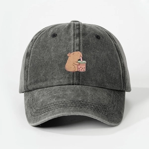 Vintage washed dark grey baseball cap featuring a cute cartoon capybara drinking boba milk tea