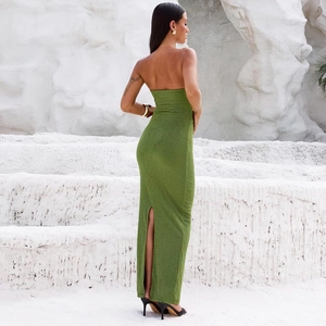 Detail of green backless bodycon maxi dress with back slit and knit texture