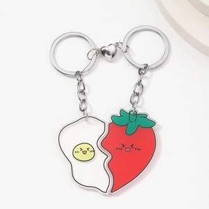 Cute acrylic couple keychains with fried egg and strawberry designs and magnetic heart connection