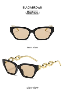 Detail of cat eye sunglasses featuring black frames, brown lenses, and gold chain temples