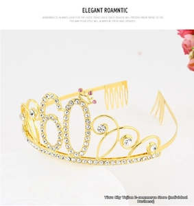 Detail of a sparkling gold 60th birthday crown headband encrusted with pink rhinestones