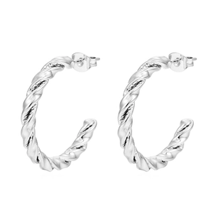 Detailed view of silver twisted C-shaped hoop earrings with polished spiral texture