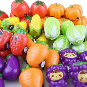 Detailed top view of colorful fruit and vegetable pull-back toy cars for children