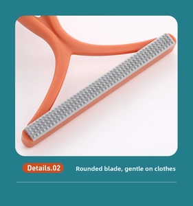 Detail of round orange lint remover head with soft silicone teeth for gentle fabric care
