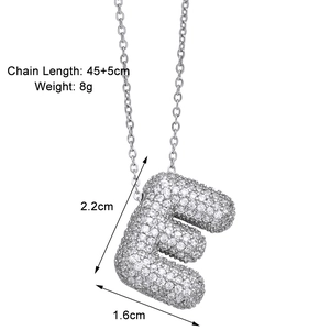 Detail showing letter E bubble pendant with pavé zircons and dimension specs