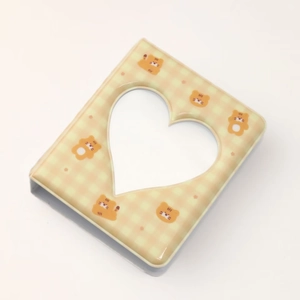 Detail of mini 3-inch photo album with beige plaid tiger pattern and heart-shaped cutout