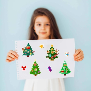 Detail of DIY Christmas tree stickers featuring festive patterns and gift box motifs