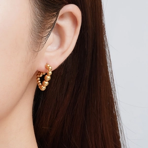 18K gold plated triangle beaded hoop earrings with a minimalist polished metallic finish