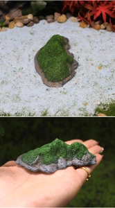 Detailed view of resin island miniature with green moss texture and grey rock base for bonsai