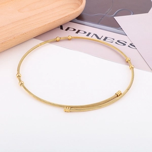 Retro stainless steel twisted wire choker necklace with gold beads and open cuff design