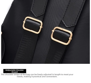 Detail of adjustable thickened shoulder straps with gold metal buckles on a black backpack