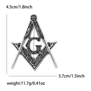 Detail view of vintage silver Freemasonry brooch with G symbol and dimension specs