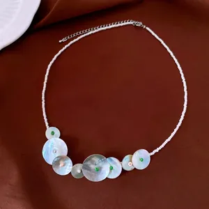 Bohemian round shell and pink quartz necklace with rainbow texture and beads