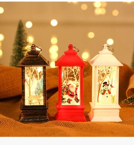 Close-up of three LED Christmas lanterns with Santa, reindeer and snowman patterns