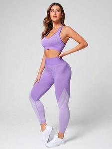 Detail of purple leopard seamless yoga set showing high waist leggings and racerback bra