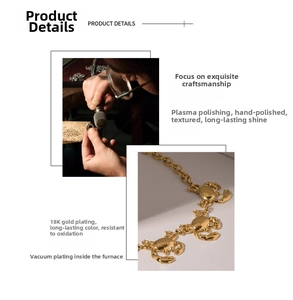 Detail of 18K gold plated crab charm bracelet with polished vacuum plating finish
