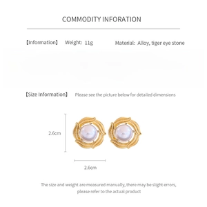 Detailed size chart showing 2.6cm dimensions for tiger eye and pearl round earrings