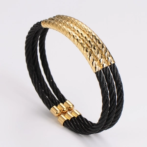 Three-layer black stainless steel wire cable cuff bracelet with gold plated metal accents