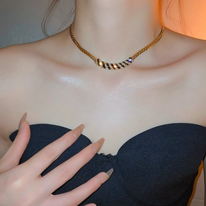 Fashionable gold plated geometric choker necklace with black stripes and sparkling crystals