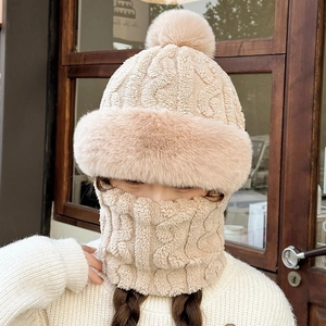Close-up of beige fleece-lined knitted hat and neck warmer set for winter warmth