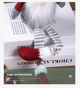 Detail showing the flexible and bendable striped long legs of the Christmas gnome doll