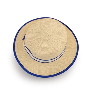 Detailed close-up showing straw hat weave texture with blue and white ribbon bow